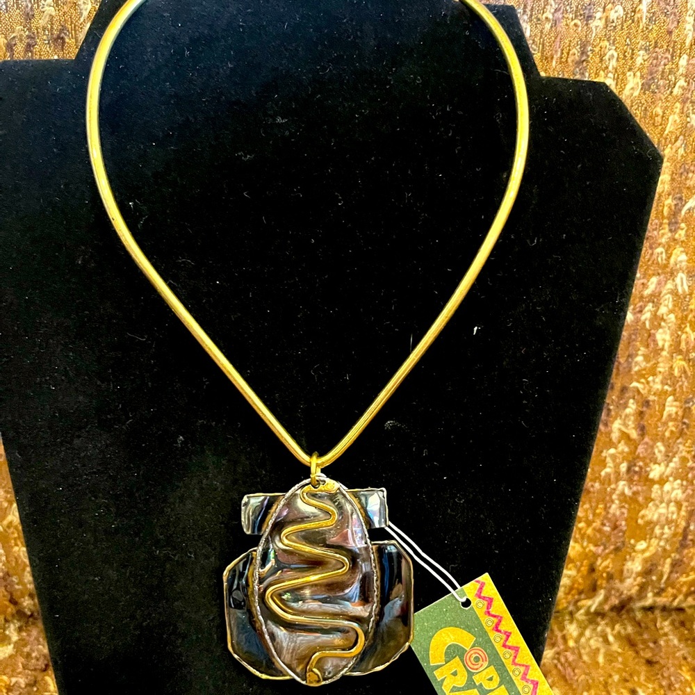 Shimmering Metal Neck Ring with Pendent